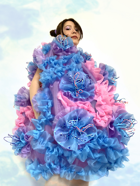 I created individual coral polyps by hand gathering multiple layers of organza and tulle in different colors together and embellished it with multicolor glass beads on copper wire to imitate corals.