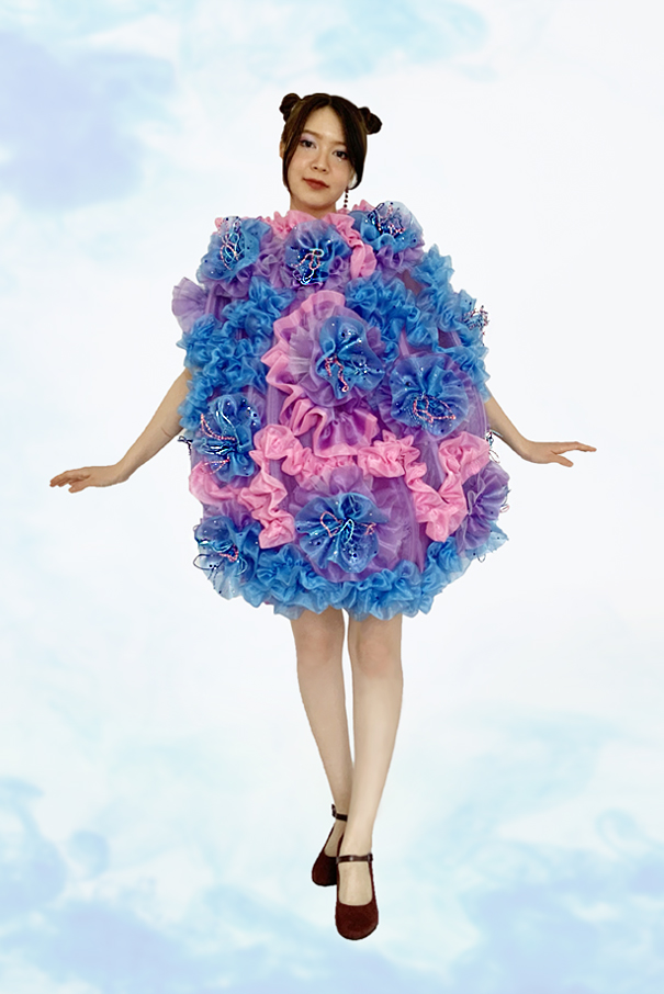 A total of 36 yards of boning and regaline together were used to create the shape that emulates a coral polyp for the overall silhouette.