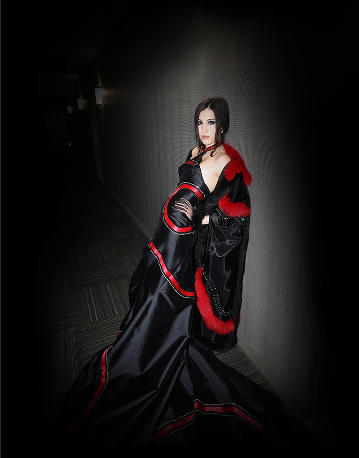 "Zero" dress and cape side view