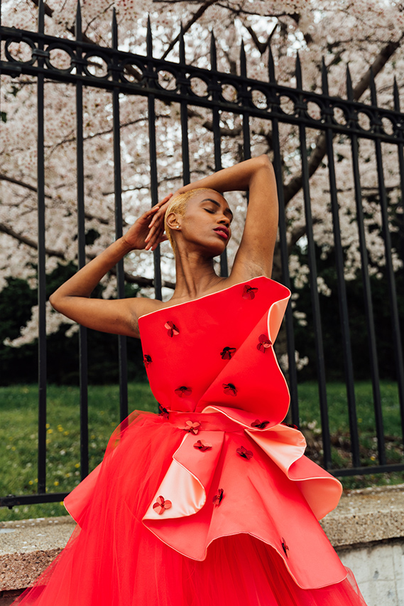 "Note 1- red satin structural pieces with pale pink satin on the inside. Red sequin embellishments scattered throughout the top. Note 2- detachable belt piece made of structural pieces. "