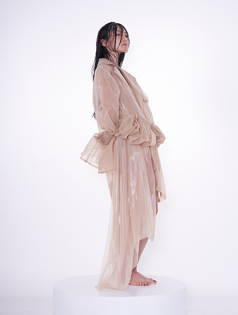 Extra volume of fabric.  Exaggerated silhouette. Translucent jacket.