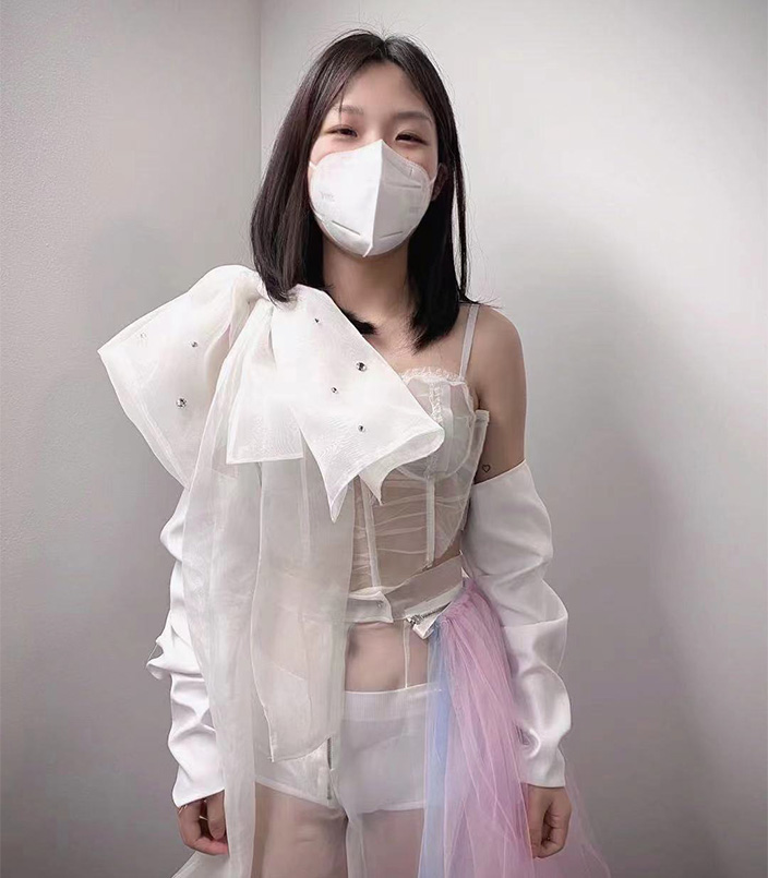 Decoratively transparent corset with organza bow on shoulder strap