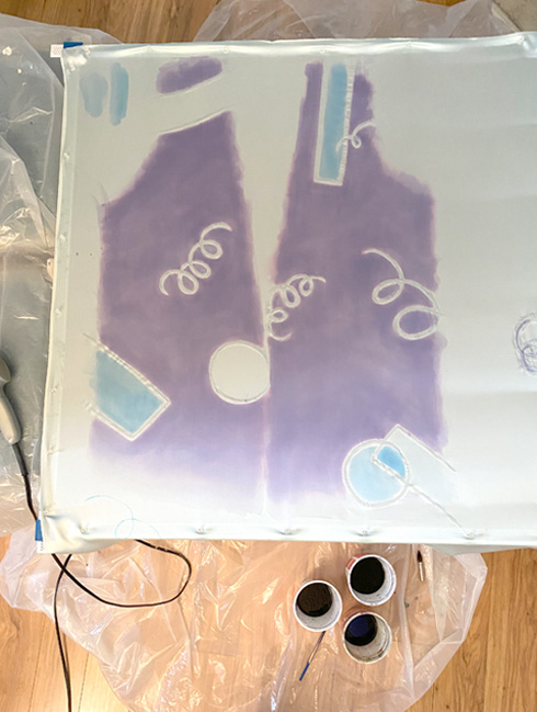 The method to paint the robe involved stretching silk charmeuse over a frame and applying a water-based resist. Jacquard silk paints were diluted with water to achieve a delicate pastel color.