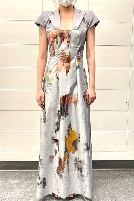 Front view. A silver pointed-shoulder blazer jointed floor-length dress, covered with silver ink.