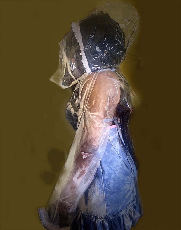 Side view of left side of jacket dress where the hoodie detail can be seen from a differnt angle.