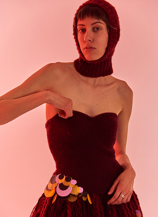 Close up of the corset, emphasizing fully fashioned techniques and embellishments