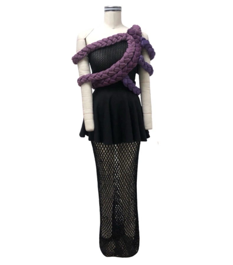 Black asymmetrical pointelle top; black circle skirt with mesh underlay; multicolor braided trims