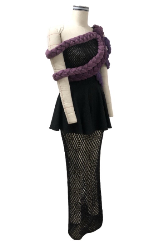 Black asymmetrical pointelle top; black circle skirt with mesh underlay; multicolor braided trims
