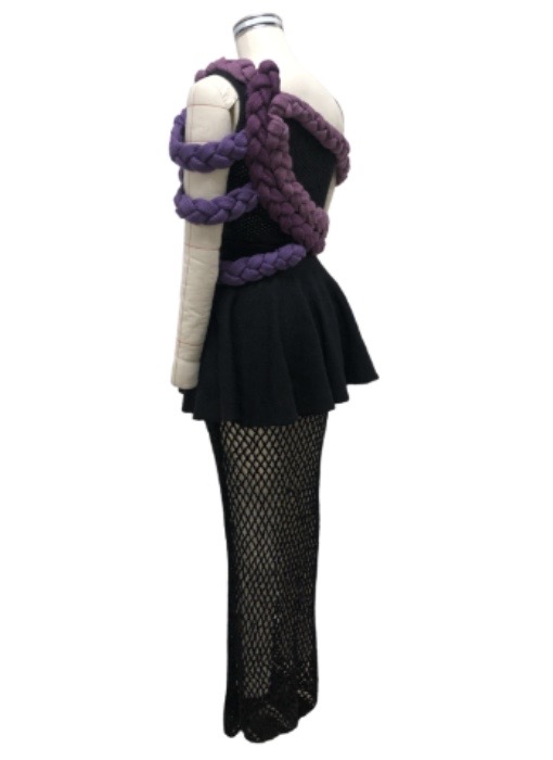Black asymmetrical pointelle top; black circle skirt with mesh underlay; multicolor braided trims