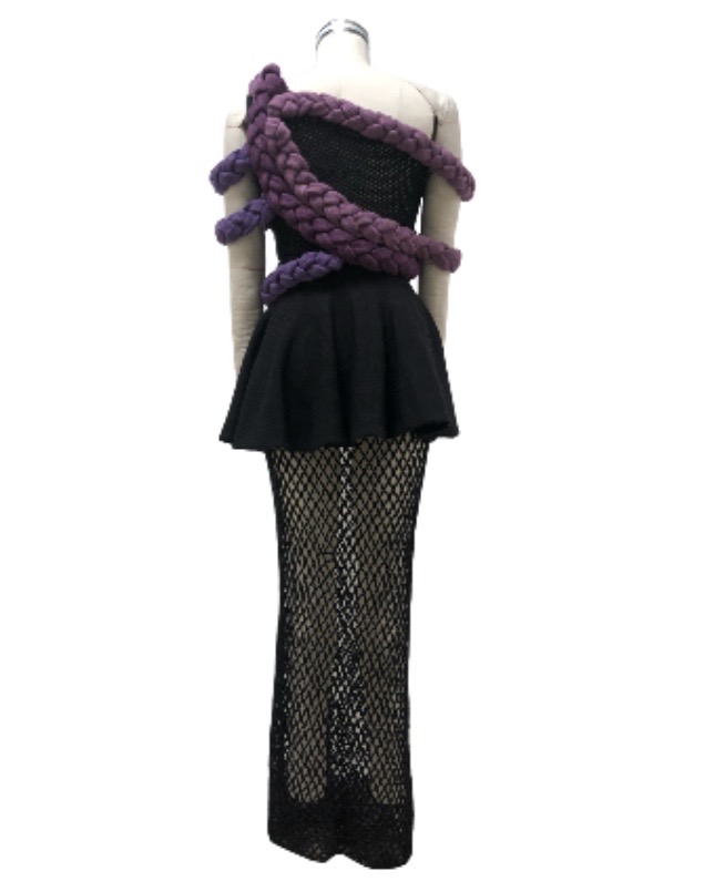 Black asymmetrical pointelle top; black circle skirt with mesh underlay; multicolor braided trims