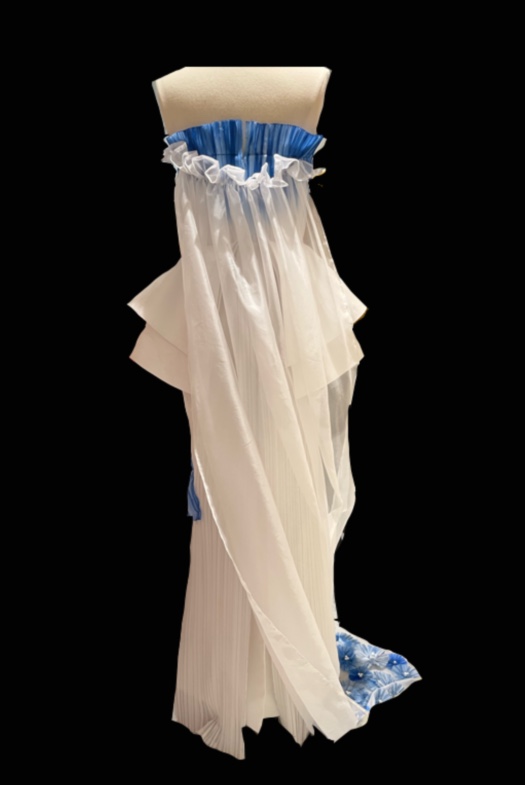 The dress is white base with blue gradient.