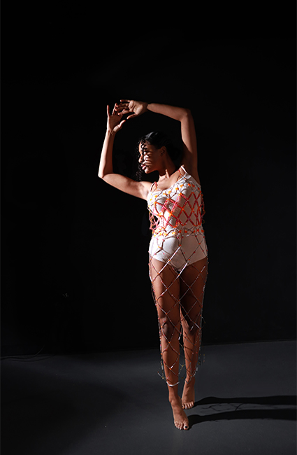 Beaded lattice dress made out of crystal beads in fuschia, hot orange, and light blush. The bead dress is ankle length.