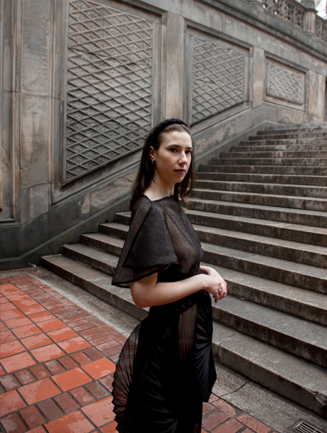 A closer look at the cape and the overlapping detail in the shoulder