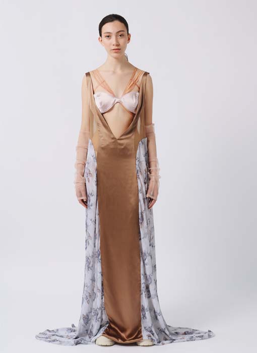Front view of the brown silk dress with the model standing straight showing all the details of the look. The bra has three straps on each side and one strap coming in from the side seam creating a triangle.