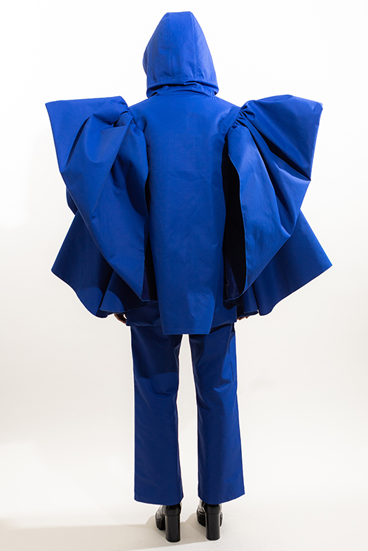 Back view of the rainsuit with draped "wings"