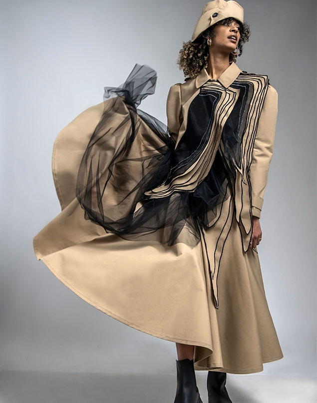 The skirt is pleated at the waist and spreads wide at the bottom. Dynamic movements appear as the model tosses the skirt.