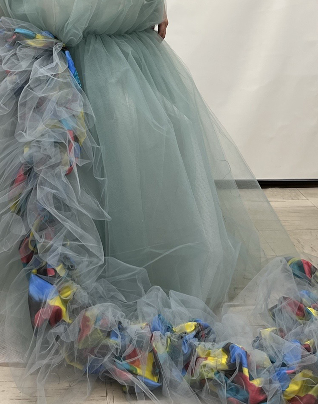 Detail of the bottom of the gown. The puff train is long to the ground.