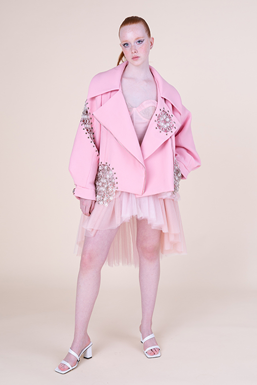 Model is shown wearing the jacket and dress, full body front shot, facing the camera.