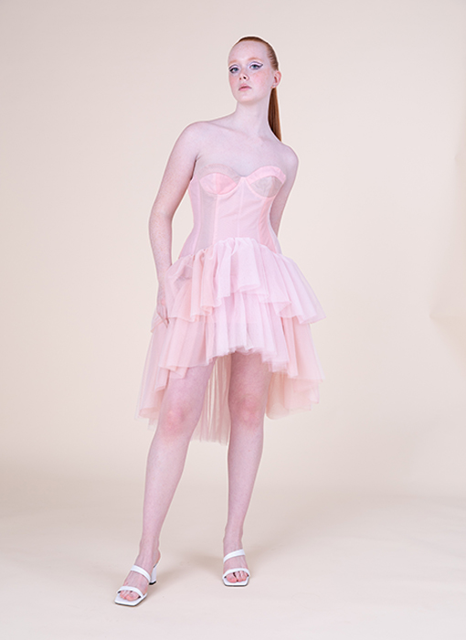 Model is shown wearing the dress only, no jacket this time, from the front. Full body photo.