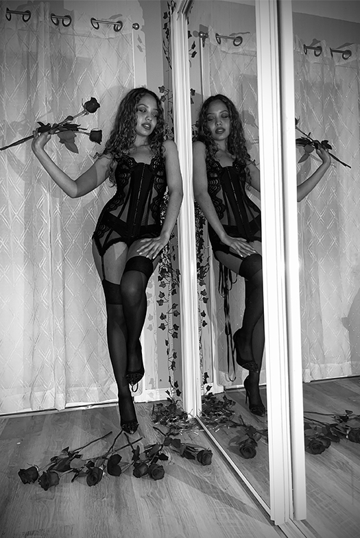 Black bustier with lacing closure on the back with three straps on each side