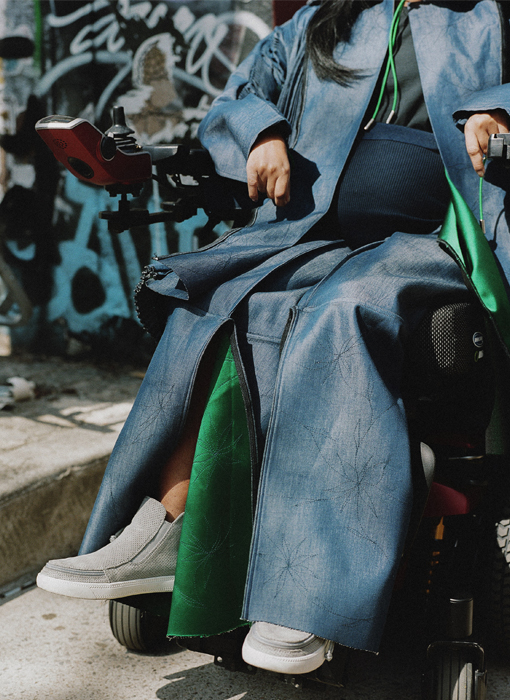 This detail shot is showcasing the side view of both the jacket and the pants in a seated position.