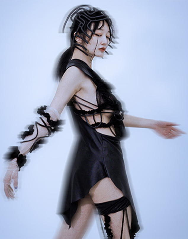 A side view of garment, model waving her arms to show the garment in motion. For this garment, I also made a 3D-print neck wear, inspired by Li tattoo, to show the concept of their head-to-toe tattoo.