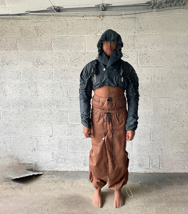 Full front view. Reversible pullover crop jacket with hood. Button-loop attachment, bolero windbreaker
