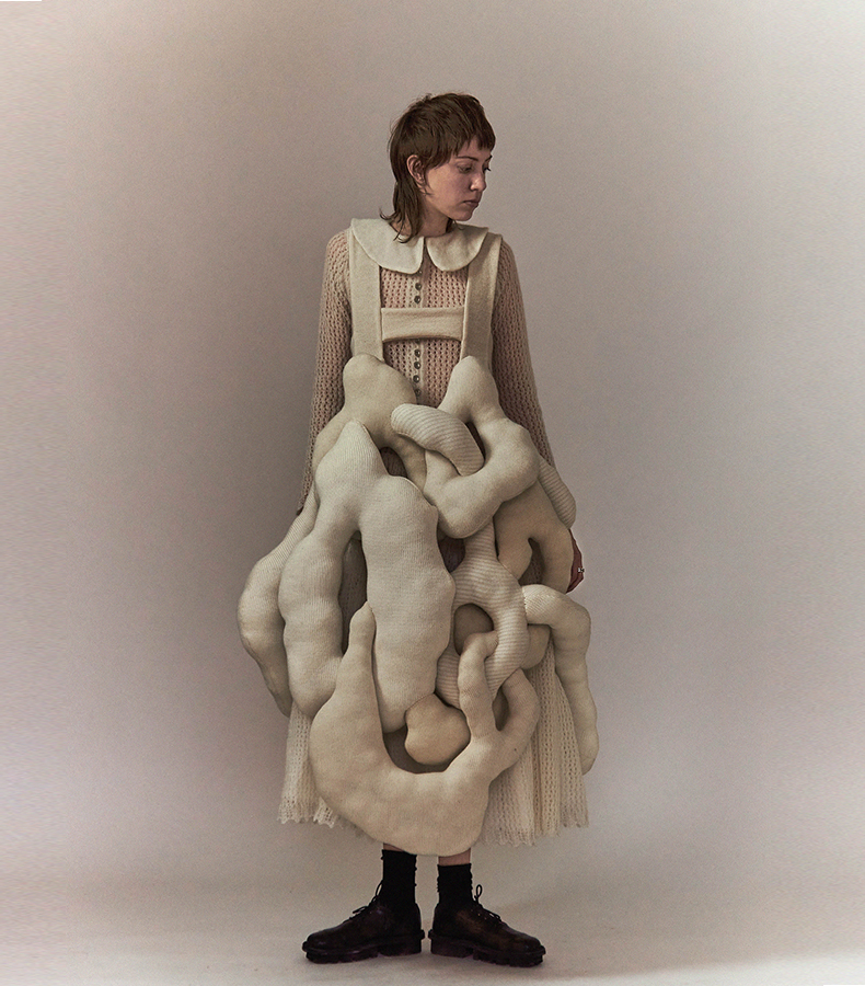 Shades of white handloomed sculptural piece overlayed on white mohair pointelle full-skirted dress