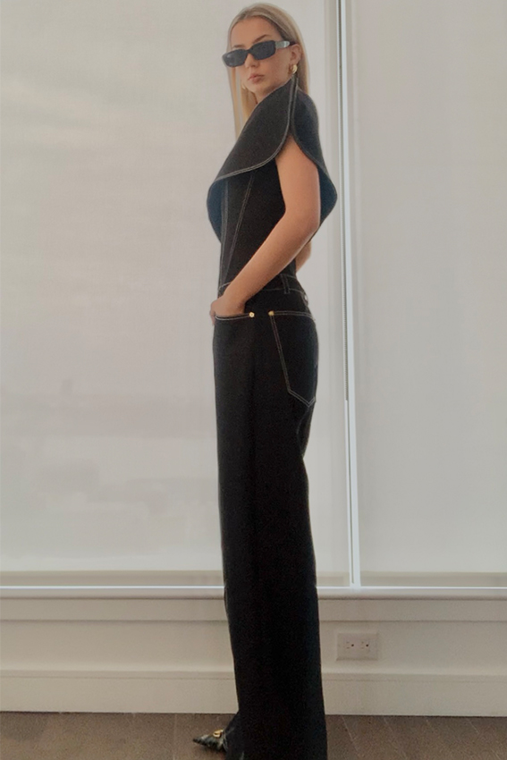 Loose-fitted bottom includes five pockets.